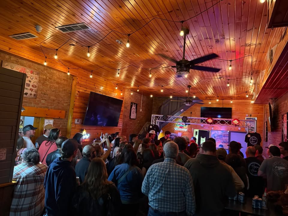Packed crowd inside bar venue
